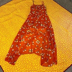 Red orange romper with flowers and flow